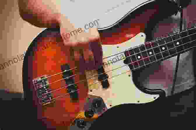 A Close Up Of A Bass Guitar Being Played With Fingerstyle Technique Complete Fingerstyle Bass Technique: The Complete Guide To Mastering Essential Modern Bass Fingerstyle Technique (Learn How To Play Bass)