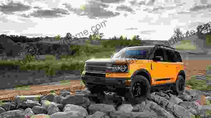 A Ford Bronco Raptor Navigating A Rugged Mountain Trail Ford Bronco: A History Of Ford S Legendary 4x4