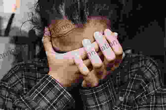 A Person Experiencing Anxiety And Stress, Holding Their Head In Their Hands. Cognitive Therapy Of Anxiety DisFree Downloads: Science And Practice