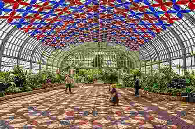 Exterior Of The Garfield Park Conservatory At Night, Illuminated By Colorful Lights Garfield Park Conservatory Daniel Thomas MacInnes