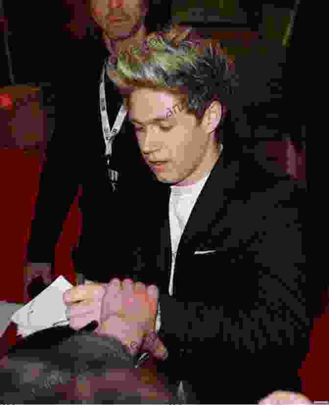 Niall Horan Signing Autographs For Fans Niall Horan: The Ultimate Fan Book: 100+ Niall Horan Facts Photos Quotes + More (Celebrity For Kids)